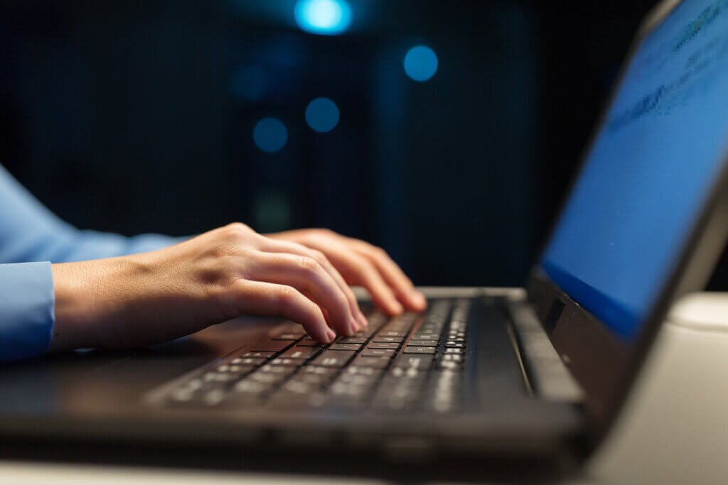 Close Up Of Female Hands With Laptop Typing